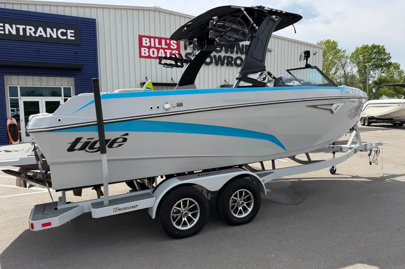 Slide: The Image of 2024 Tigé Z1 boat on trailer outside Bill's Boats showroom. - 3