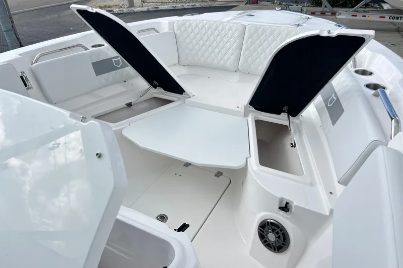 Slide: The Image of 2026 Sea Fox 268 Commander boat interior with open storage compartments and seating. - 10