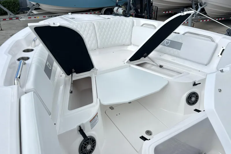 Slide: The Image of 2026 Sea Fox 268 Commander boat interior with open storage compartments and seating. - 11