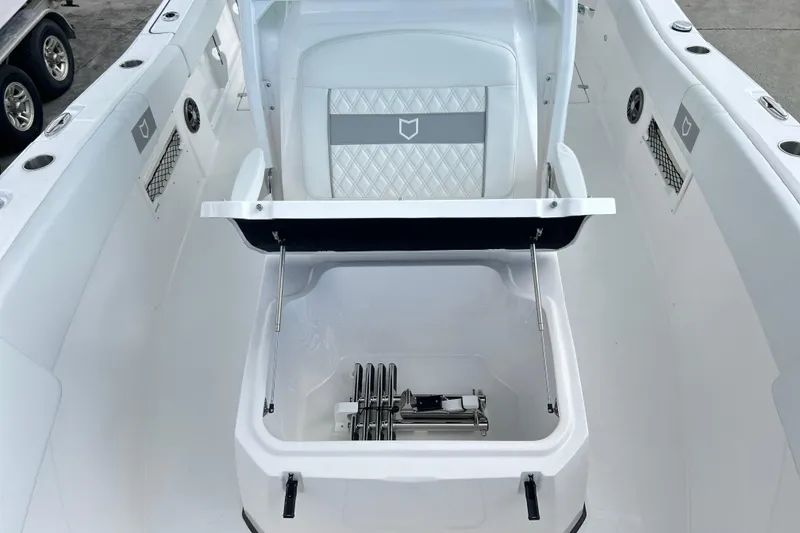 Slide: The Image of 2026 Sea Fox 268 Commander boat interior with open storage compartment and seating. - 12
