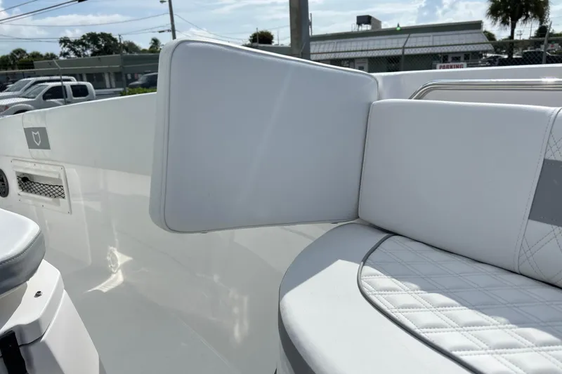 Slide: The Image of 2026 Sea Fox 268 Commander boat interior with white cushioned seating. - 18