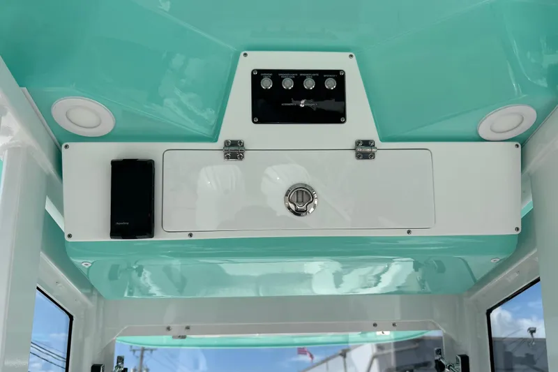 Slide: The Image of Interior view of 2026 Sea Fox 268 Commander boat's control panel and storage compartment. - 20