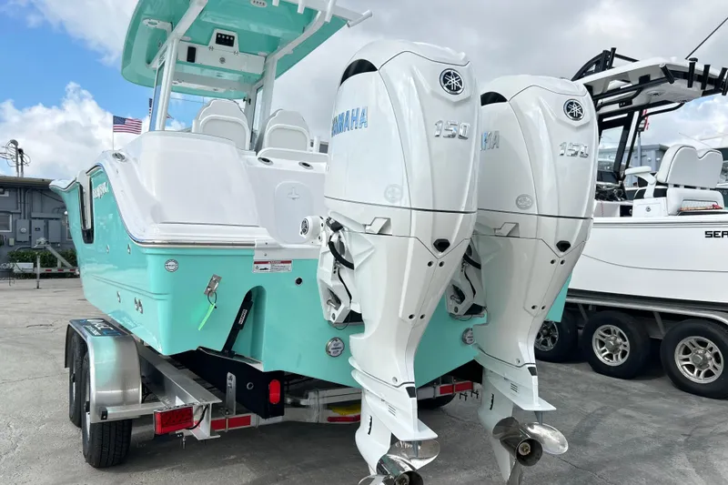 Slide: The Image of 2026 Sea Fox 268 Commander boat with twin Yamaha 150 engines on a trailer. - 3