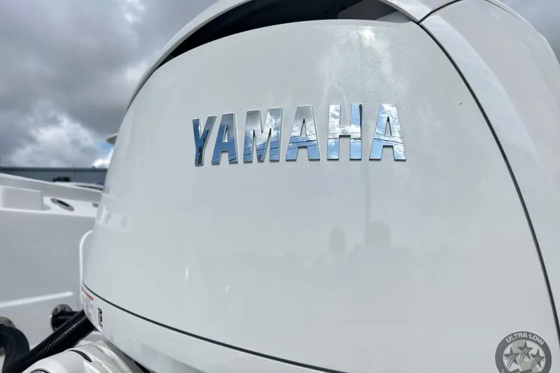 Slide: The Image of Yamaha engine on 2026 Sea Fox 268 Commander boat under cloudy sky. - 4