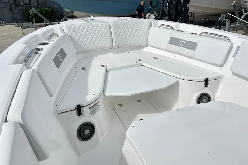 Slide: The Image of 2026 Sea Fox 268 Commander boat interior with white seating and table. - 7