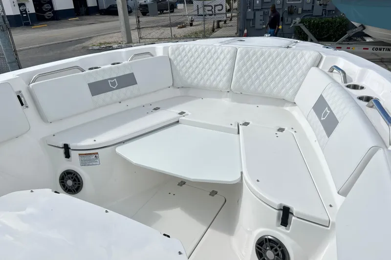 Slide: The Image of Luxurious seating area on 2026 Sea Fox 268 Commander boat with white upholstery and table. - 8