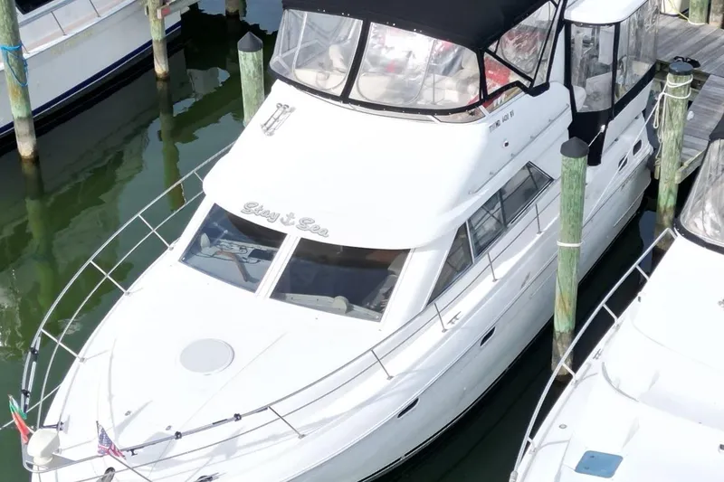 Slide: The Image of 1997 Cruisers Yachts 3650 Motoryacht docked at marina, aerial view. - 5