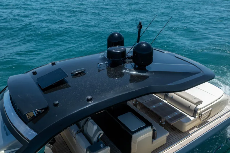 Slide: The Image of 2024 Invictus 460 yacht cruising on blue ocean waters. - 10