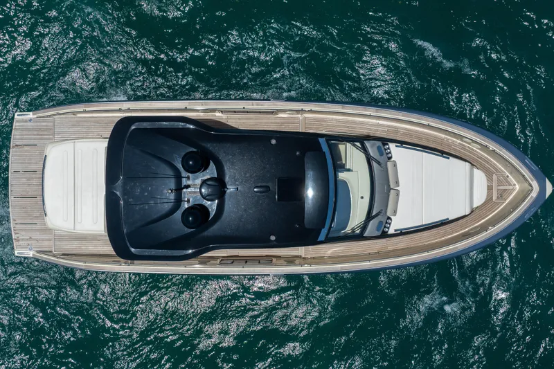 Slide: The Image of Aerial view of 2024 Invictus 460 yacht on blue ocean water. - 11