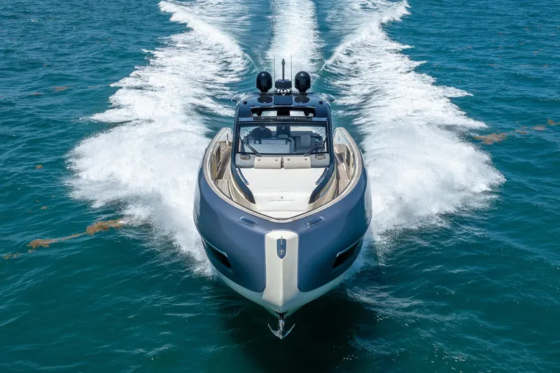 Slide: The Image of 2024 Invictus 460 yacht cruising on open water, showcasing sleek design and powerful performance. - 15