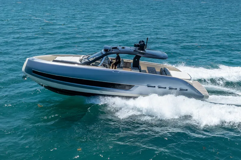 Slide: The Image of 2024 Invictus 460 yacht cruising on open sea, showcasing sleek design and performance. - 16