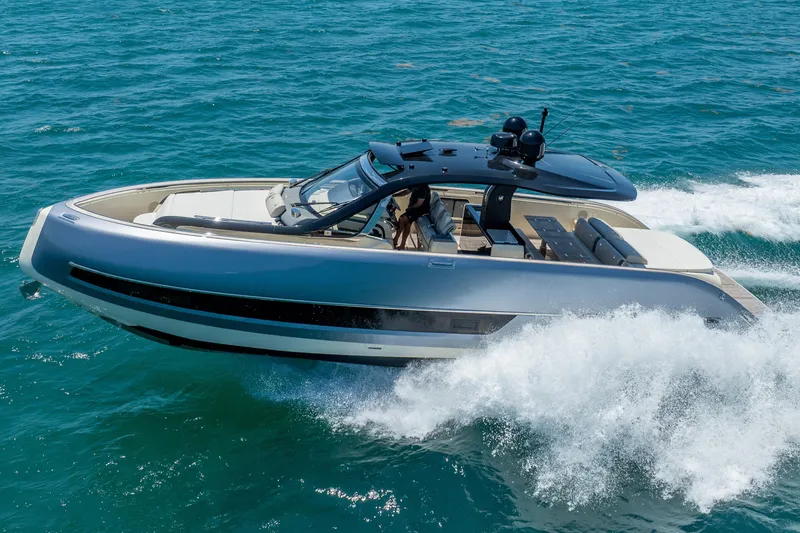 Slide: The Image of 2024 Invictus 460 yacht cruising on open sea, showcasing sleek design and luxury features. - 17