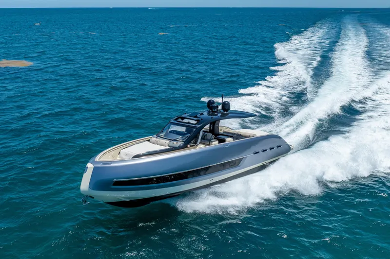 Slide: The Image of 2024 Invictus 460 yacht cruising on open blue sea, showcasing sleek design and powerful performance. - 21