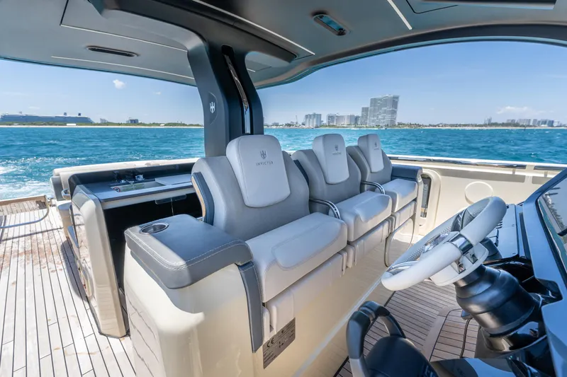 Slide: The Image of Luxurious 2024 Invictus 460 yacht interior with plush seating and ocean view. - 29