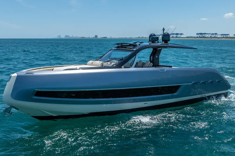 Slide: The Image of 2024 Invictus 460 yacht cruising on open sea under clear blue sky. - 3