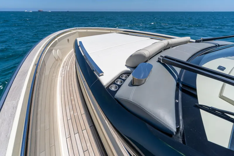 Slide: The Image of Luxury Invictus 460 yacht deck with sleek design, cruising on open sea, 2024 model. - 32
