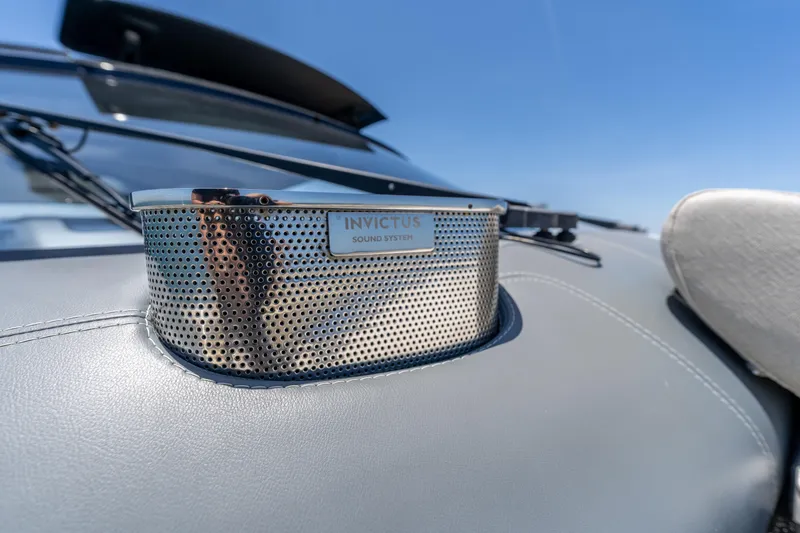Slide: The Image of 2024 Invictus 460 sound system detail on luxury yacht dashboard. - 37