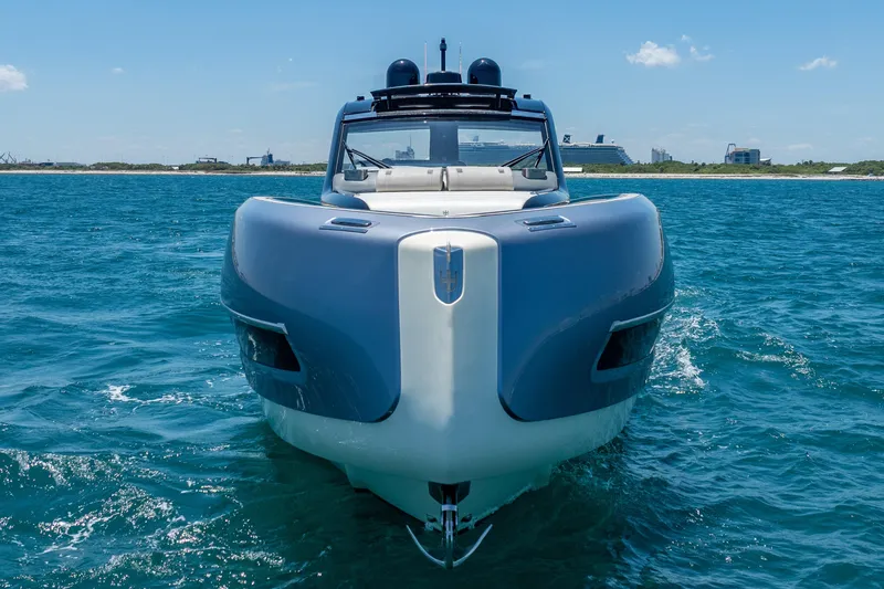 Slide: The Image of 2024 Invictus 460 yacht cruising on blue ocean waters. - 4