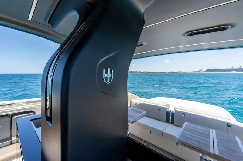 Slide: The Image of Luxurious 2024 Invictus 460 yacht interior with ocean view and elegant seating area. - 43