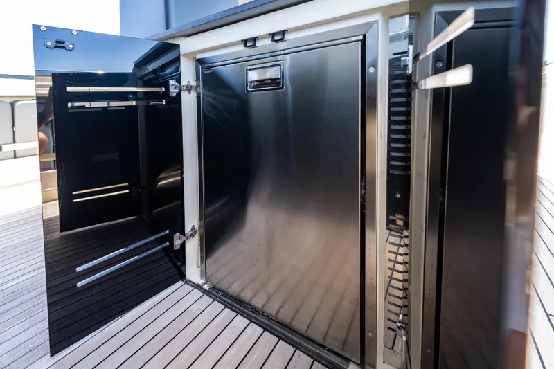 Slide: The Image of Stainless steel cabinet on 2024 Invictus 460 yacht deck, open door revealing interior. - 47