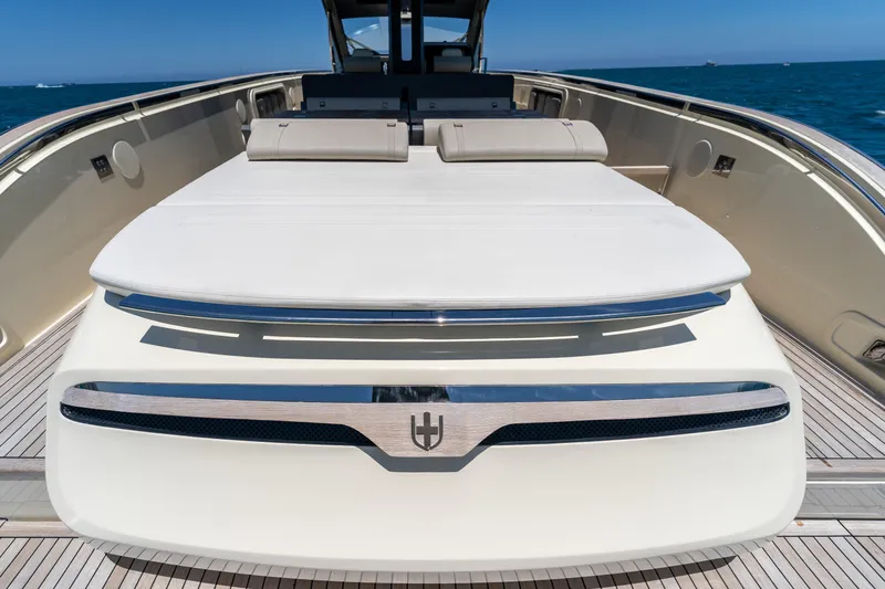 Slide: The Image of 2024 Invictus 460 yacht deck with luxurious sunbathing area on open sea. - 53