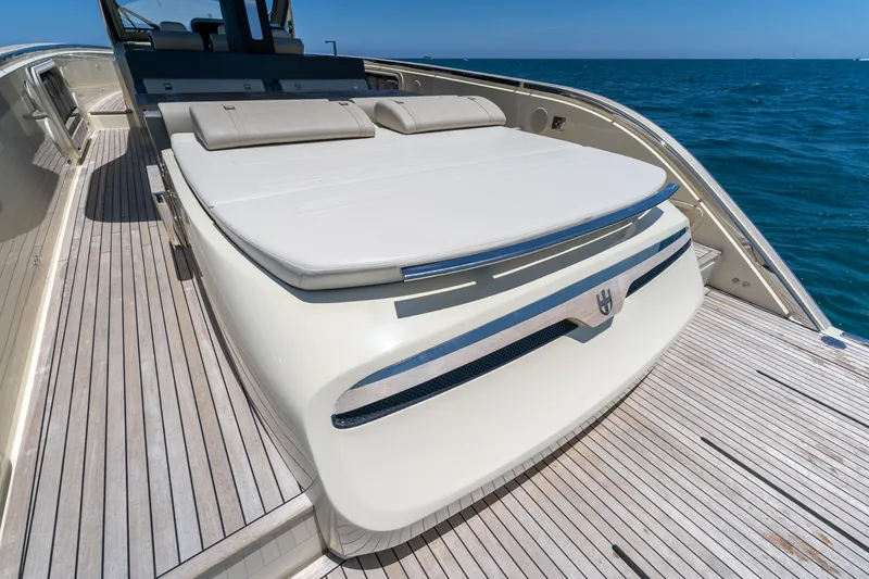 Slide: The Image of Luxurious 2024 Invictus 460 yacht deck with sunbathing area, cruising on open sea. - 54
