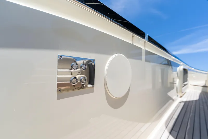 Slide: The Image of 2024 Invictus 460 yacht exterior detail with control panel and speaker. - 57