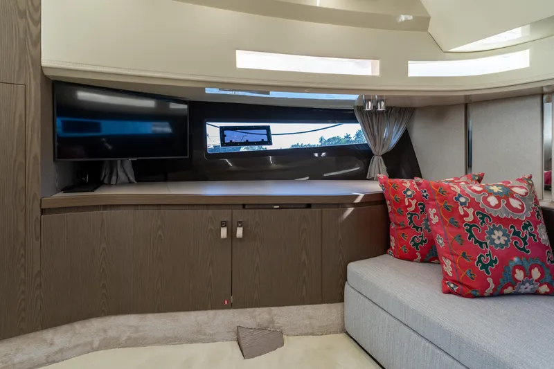 Slide: The Image of Luxurious interior of 2024 Invictus 460 yacht with TV, wood cabinetry, and vibrant cushions. - 65
