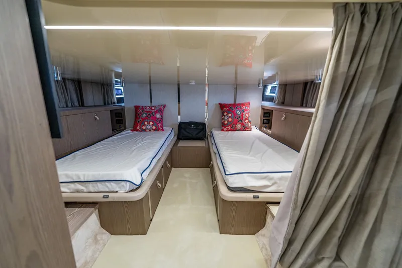 Slide: The Image of Luxurious twin cabin interior of 2024 Invictus 460 yacht with elegant decor. - 76