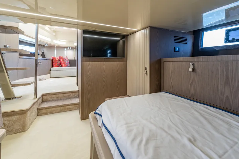 Slide: The Image of Luxurious interior of 2024 Invictus 460 yacht featuring modern design and comfortable bedding. - 78