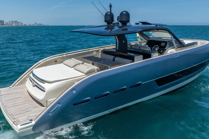 Slide: The Image of 2024 Invictus 460 yacht cruising on blue ocean waters, showcasing sleek design and luxury features. - 8
