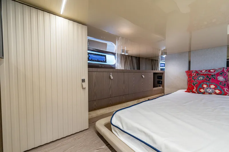 Slide: The Image of Luxurious interior of 2024 Invictus 460 yacht with elegant bedding and modern cabinetry. - 80
