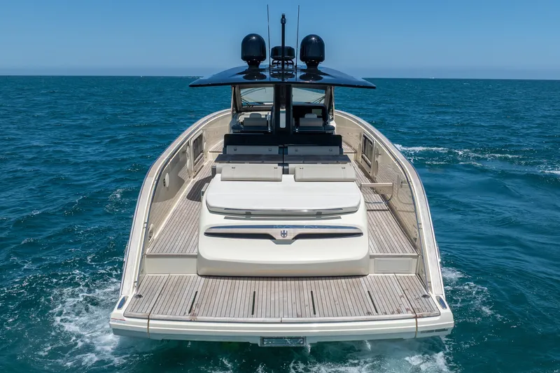 Slide: The Image of 2024 Invictus 460 yacht cruising on open sea, showcasing sleek design and luxury features. - 9