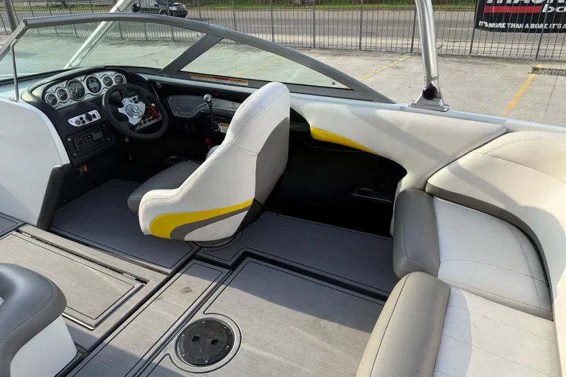 Slide: The Image of 2005 MasterCraft X10 boat interior with steering wheel and seating. - 12
