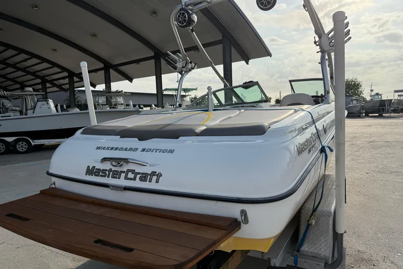 Slide: The Image of 2005 MasterCraft X10 Wakeboard Edition boat in a marina setting. - 4