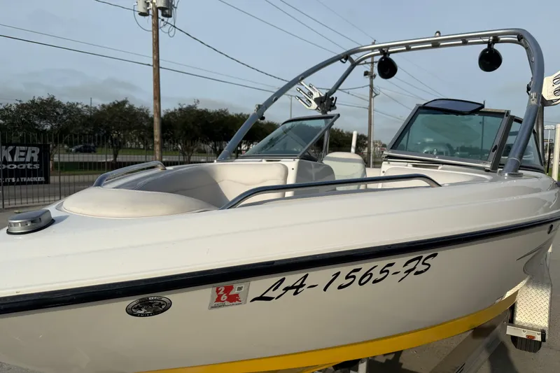 Slide: The Image of 2005 MasterCraft X10 boat with registration number, parked on a trailer. - 9