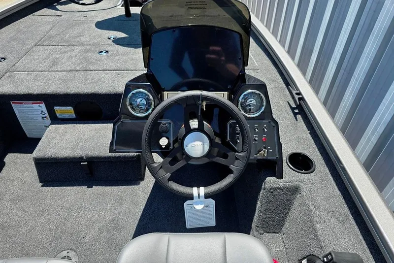 Slide: The Image of 2026 Lowe Stinger 175 boat dashboard with steering wheel and control panel. - 9
