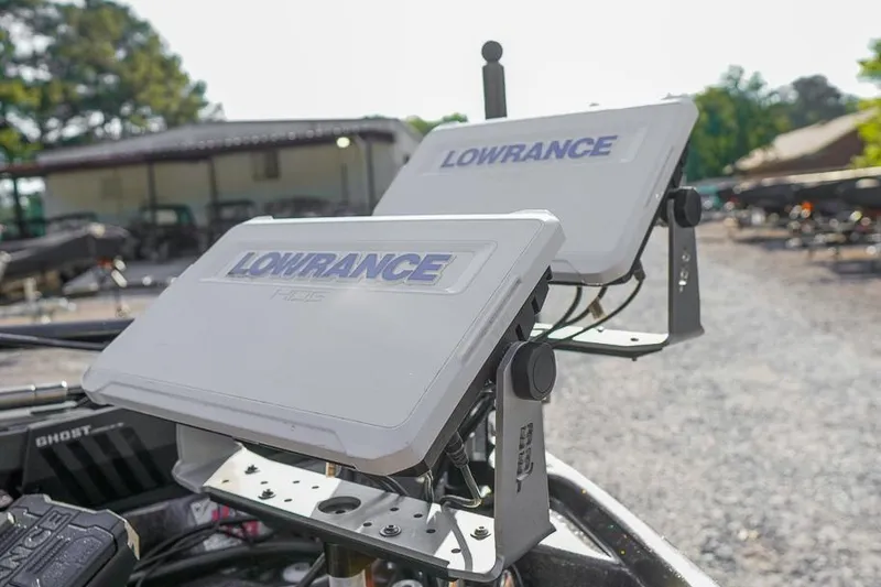 Slide: The Image of Lowrance HDS displays on a 2023 Bass Cat Puma STS boat, outdoor setting. - 14