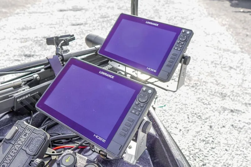 Slide: The Image of Dual Lowrance HDS displays on 2023 Bass Cat Puma STS boat dashboard. - 18