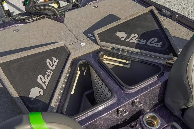 Slide: The Image of 2023 Bass Cat Puma STS boat storage compartments with open lids and logo. - 20