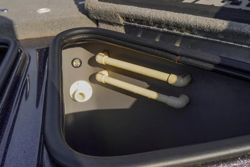 Slide: The Image of 2023 Bass Cat Puma STS storage compartment with pipes and fittings. - 21