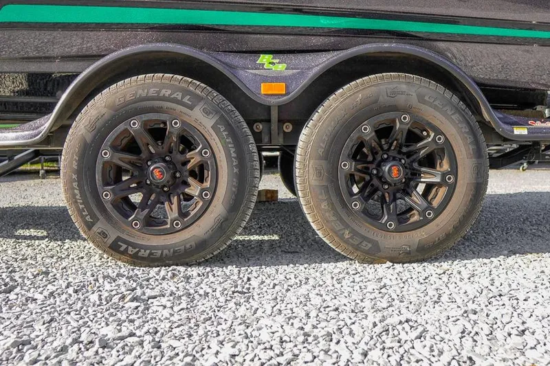 Slide: The Image of 2023 Bass Cat Puma STS trailer wheels on gravel surface. - 28