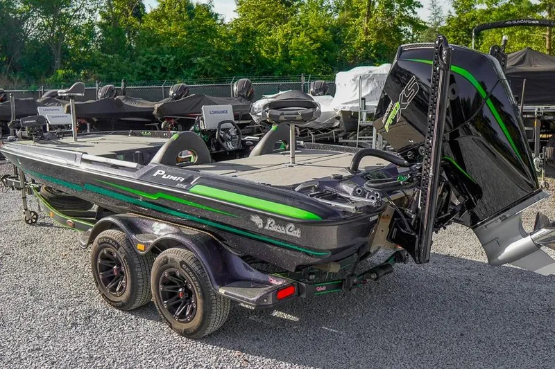 Slide: The Image of 2023 Bass Cat Puma STS boat with sleek design and vibrant green accents. - 3