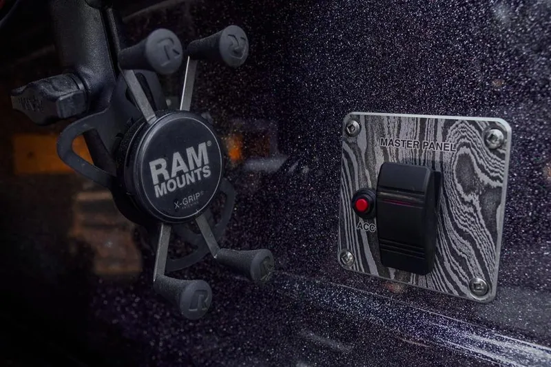Slide: The Image of 2023 Bass Cat Puma STS dashboard with RAM Mounts X-Grip and master panel switch. - 9