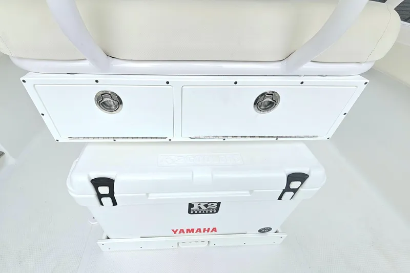 Slide: The Image of Sea Hunt Ultra 235 SE 2025 with Yamaha cooler and storage compartments. - 12