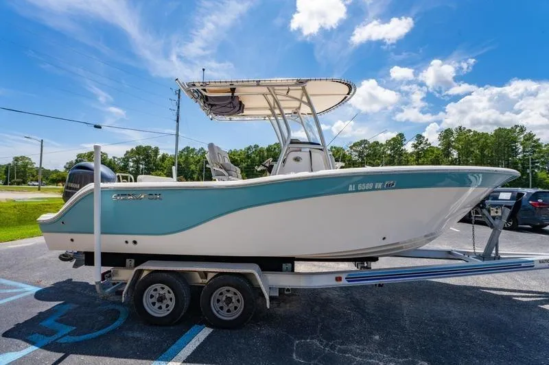 Slide: The Image of 2021 Sea Fox 228 Commander boat on trailer under clear blue sky. - 18