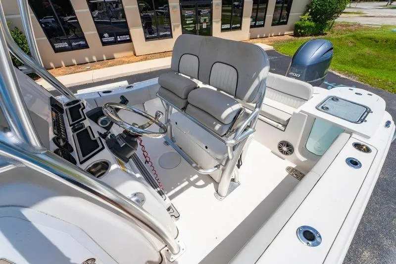 Slide: The Image of 2021 Sea Fox 228 Commander boat interior with helm, seating, and Yamaha outboard motor. - 20
