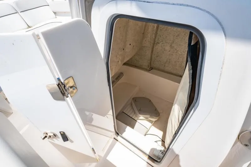 Slide: The Image of 2021 Sea Fox 228 Commander boat cabin interior with open door. - 5