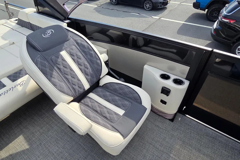 Slide: The Image of Luxurious seating on 2025 Barletta Lusso 25UCA boat with cup holders and elegant design. - 14