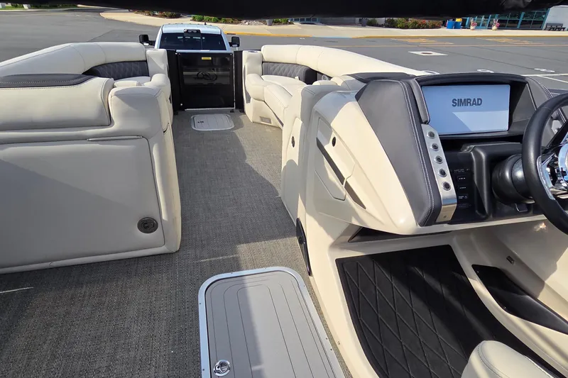 Slide: The Image of Luxurious interior of 2025 Barletta Lusso 25UCA pontoon boat with Simrad navigation system. - 19